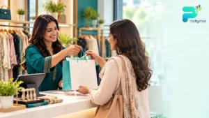 Pakistani boutique owner in Lahore serving a returning customer as part of a retail customer retention strategy